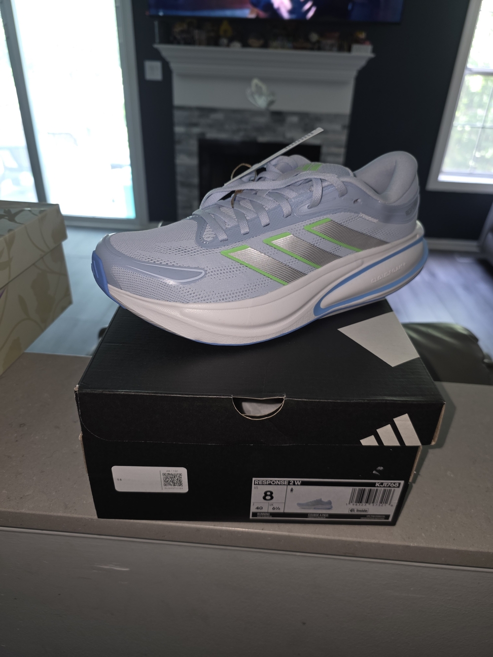 Adidas Response 2 Women's Light Blue Running Shoes with Lime Accents.